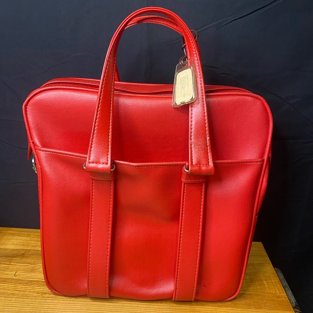 Vintage Samsonite red leather carry on.